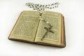 Opened catholic holy prayer book Treasury of the Sacred Heart and white beads crucifix with holy cross isolated on a white Royalty Free Stock Photo