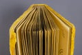 Opened old photo album wrapped in yellow velvet on gray background Royalty Free Stock Photo