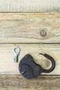 Opened old rusty lock with key lying near. Copy space. Looking for problem solution concept in steampunk style Royalty Free Stock Photo
