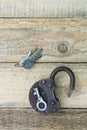 Opened old rusty lock with several keys lying near. Copy space. Looking for problem solution concept in steampunk style Royalty Free Stock Photo