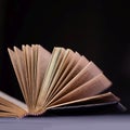 Opened old book with gold pages on a black background Royalty Free Stock Photo