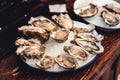 Opened Oysters Fines de Claire on plate with ice