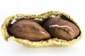Opened Peanuts on the white background Royalty Free Stock Photo
