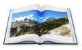 Opened photobook isolated on white background with wonderful view of the Dolomites Italy.On background the view of Auronzo