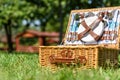 Opened Picnic Basket With Cutlery In Green Grass Royalty Free Stock Photo