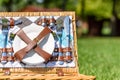 Opened Picnic Basket With Cutlery In Green Grass Royalty Free Stock Photo