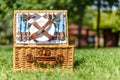 Opened Picnic Basket With Cutlery In Green Grass Royalty Free Stock Photo