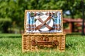 Opened Picnic Basket With Cutlery In Green Grass Royalty Free Stock Photo