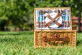 Opened Picnic Basket With Cutlery In Green Grass Royalty Free Stock Photo