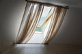 Opened rooftop window, view from room, Transparent curtains cover window Royalty Free Stock Photo