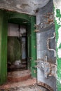 Opened rusty armored hermetic door, entrance to abandoned Soviet bunker