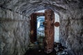 Opened rusty armored hermetic door, entrance to abandoned Soviet warship ammunition depot