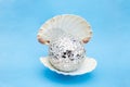 opened sea shell with a mirrors disco ball inside as a pearl Royalty Free Stock Photo