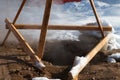 Manhole with hot white steam in winter time on street, broken sewage system. Royalty Free Stock Photo