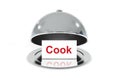 Opened silver cloche with white sign cook Royalty Free Stock Photo