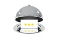 Opened silver cloche with white sign three stars rating Royalty Free Stock Photo