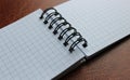 Opened spiral notebook on leather table detailed stock photo Royalty Free Stock Photo