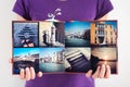 Opened square travel photo album in woman hands Royalty Free Stock Photo