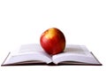 Opened student book with red apple