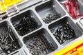 Opened tackle box with fishing hooks and accessories. Fishing hooks in box sections. Case for tackle elements. Fishing accessories Royalty Free Stock Photo