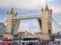 Opened Tower Bridge, boat passing under, on Thames, in a sunny day, London, UK Royalty Free Stock Photo