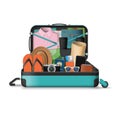 Opened travel suitcase full of things for vacation Royalty Free Stock Photo