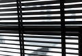Opened venetian plastic blinds in black and white. Plastic window with blinds. Interior design of living room with window
