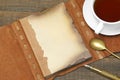 Opened Vintage Notebook With Blank Brown Page, Pen, Teacup, Spoon Royalty Free Stock Photo