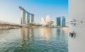 Opened white door to blurred skyline of singapore cityscape