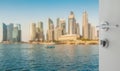 Opened white door to blurred skyline of singapore cityscape