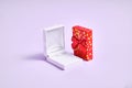 Opened white empty ring box and golden red box. Proposal in christmas. Valentines day jewelry