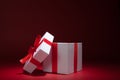 Opened white gift box on red background Royalty Free Stock Photo