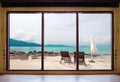 Opened window seeing tropical beach view in summer holiday at weekend house and resort Royalty Free Stock Photo