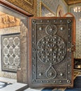 Opened wooden aged door with ornate bronzed floral patterns, Mosque of The Manial Palace of Prince Mohammed Ali, Cairo, Egypt