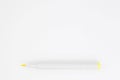 opened yellow marker laying on blank white page Royalty Free Stock Photo