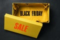 Opened yellow shoebox on a dark background with the text Black Friday Sale