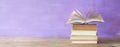 Openend book on purple background