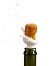 Opening a bottle of champagne, cork flyes out of the bottle with splashes Royalty Free Stock Photo