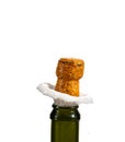 Opening a bottle of champagne, cork flyes out of the bottle with splashes Royalty Free Stock Photo