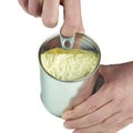 Opening can with powdered milk.