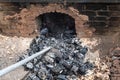 opening of a ceramic kiln, Unique handmade pots and dishes of clay getting black after firing and oxygen reducing