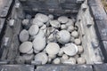 opening of a ceramic kiln, Unique handmade pots and dishes of clay getting black after firing and oxygen reducing