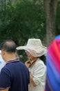 A stylish mother wearing a hat and sunglasses at the opening ceremony for freshmen, Central South University, China
