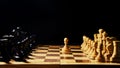 The opening of the chess game with the move of the white king pawn e2-e4, copy space on a black background Royalty Free Stock Photo