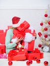 Opening christmas gift. Girl near christmas tree happy celebrate holiday. Santa bring her gift that she always wanted Royalty Free Stock Photo