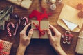 Opening Christmas present. Royalty Free Stock Photo