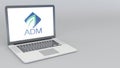 Opening and closing laptop with Archer Daniels Midland logo. 4K editorial animation