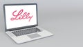 Opening and closing laptop with Eli Lilly And Company logo. 4K editorial 3D rendering