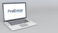 Opening and closing laptop with Firstenergy logo. 4K editorial 3D rendering Royalty Free Stock Photo