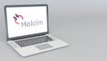 Opening and closing laptop with Holcim logo. 4K editorial 3D rendering Royalty Free Stock Photo